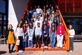 Brain Bee participants line up on a set of stairs joined by student organization and faculty leaders.