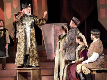 An impassioned King Lear (Fred Curchack) speaks to his court in a scene from Shakespeare Dallas’ production of the tragedy. Performances continue through Saturday. A man playing King Lear shouts at his daughter.